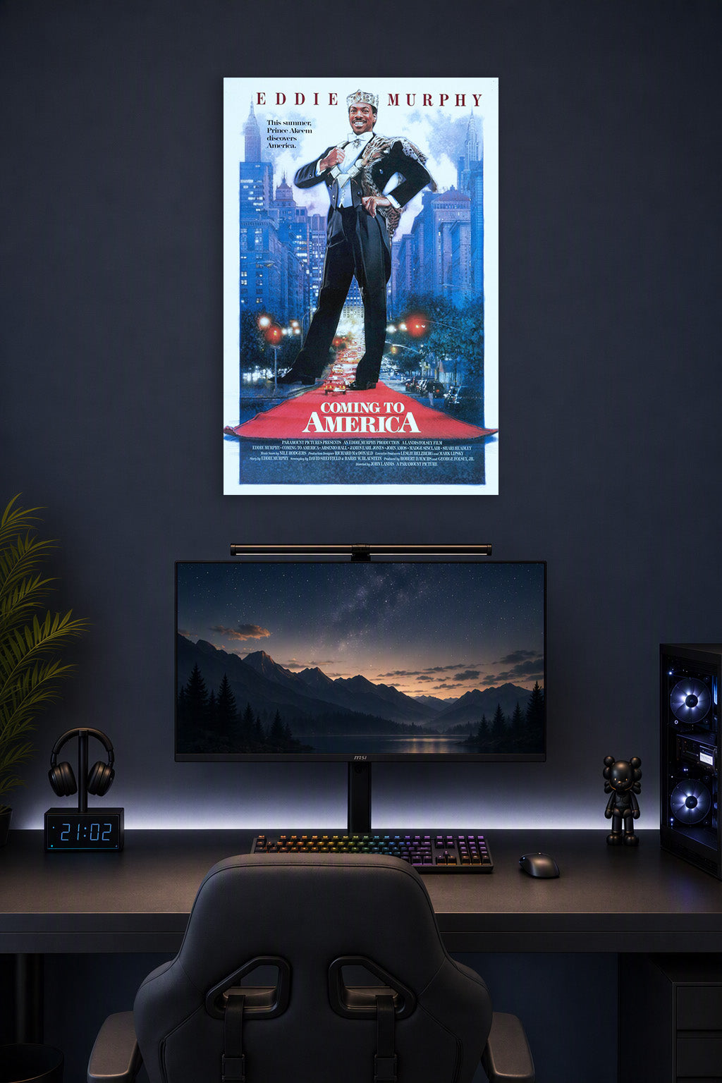 Coming to America Movie Poster in a gaming desk setup above a monitor.