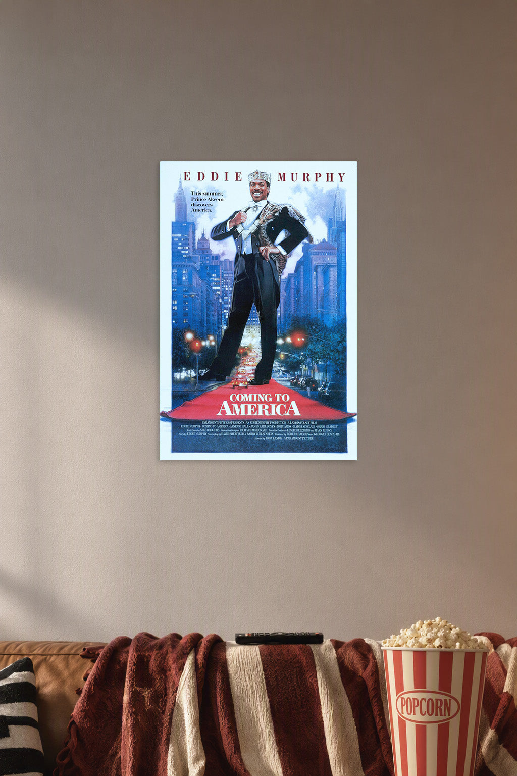 Coming to America Movie Poster in a cozy movie room above a brown sofa with popcorn.