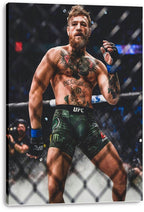 Conor McGregor canvas wall art print displays the tattooed fighter raising a gloved hand in the octagon under arena lights.