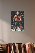 Conor McGregor in a cozy movie room above a brown sofa with popcorn.