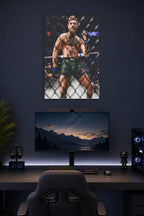Conor McGregor in a gaming desk setup above a monitor.
