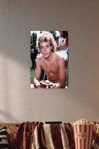 Corey Haim in a cozy movie room above a brown sofa with popcorn.