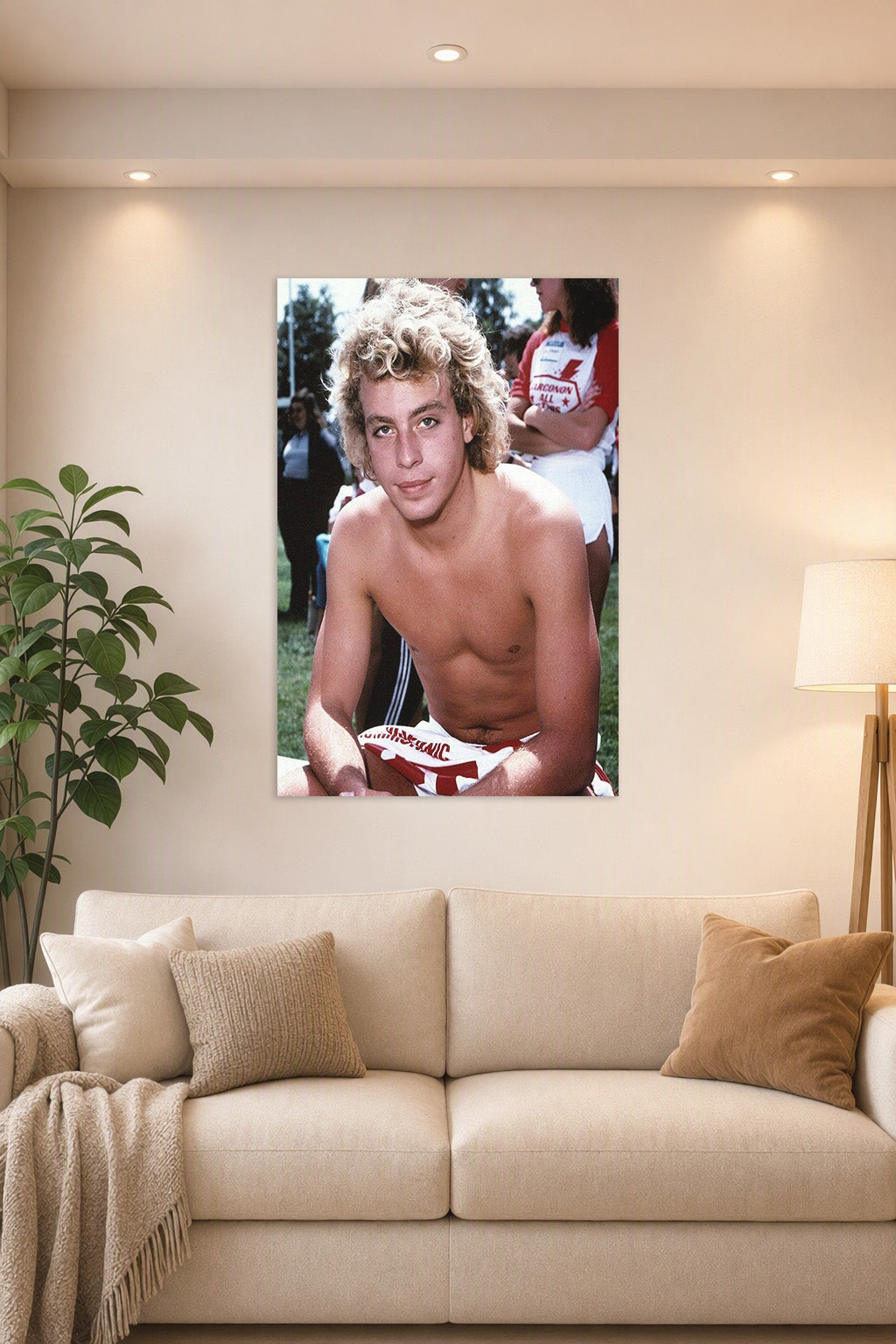 Corey Haim in a bright living room above a beige sofa.