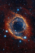 Helix Nebula wall art print depicts a glowing orange gas ring around a deep blue center amid red space and bright stars.