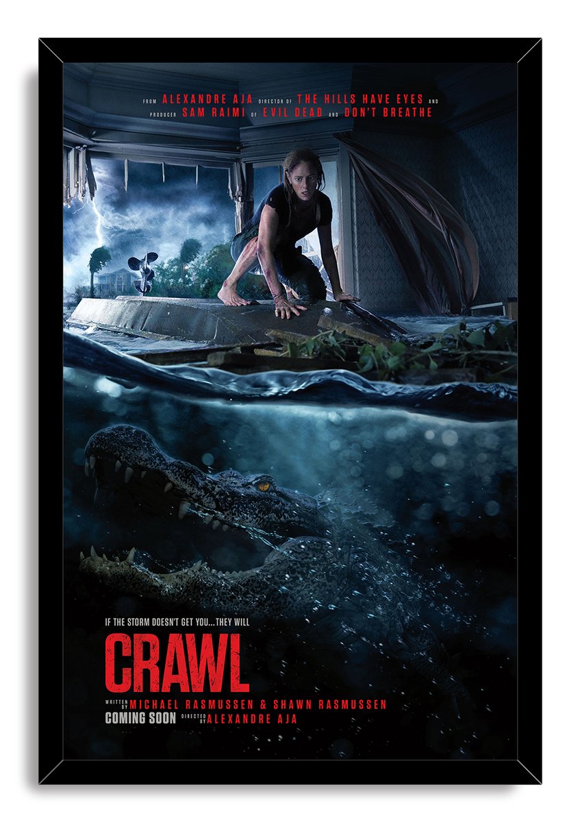 Crawl movie poster wall art print in a black frame depicts a woman above a menacing alligator amid hurricane floodwater.