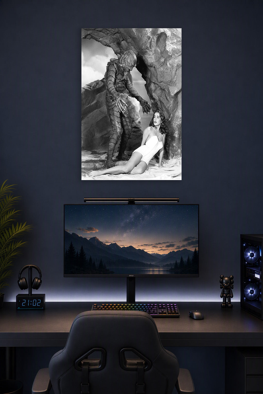 Creature From The Black Lagoon in a gaming desk setup above a monitor.