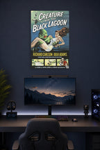 Creature from the Black Lagoon in a gaming desk setup above a monitor.