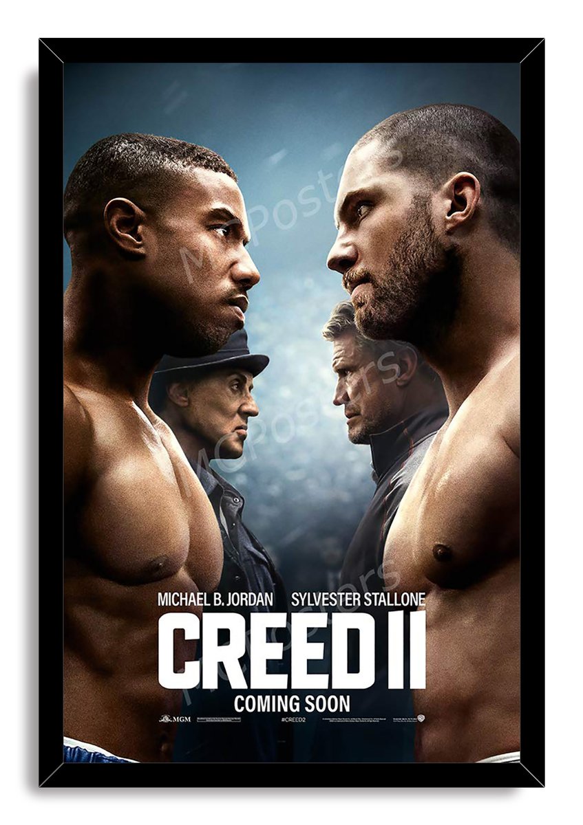 Creed II framed wall art print with a black border, featuring opposing boxers, their mentors, and large white film title lettering.