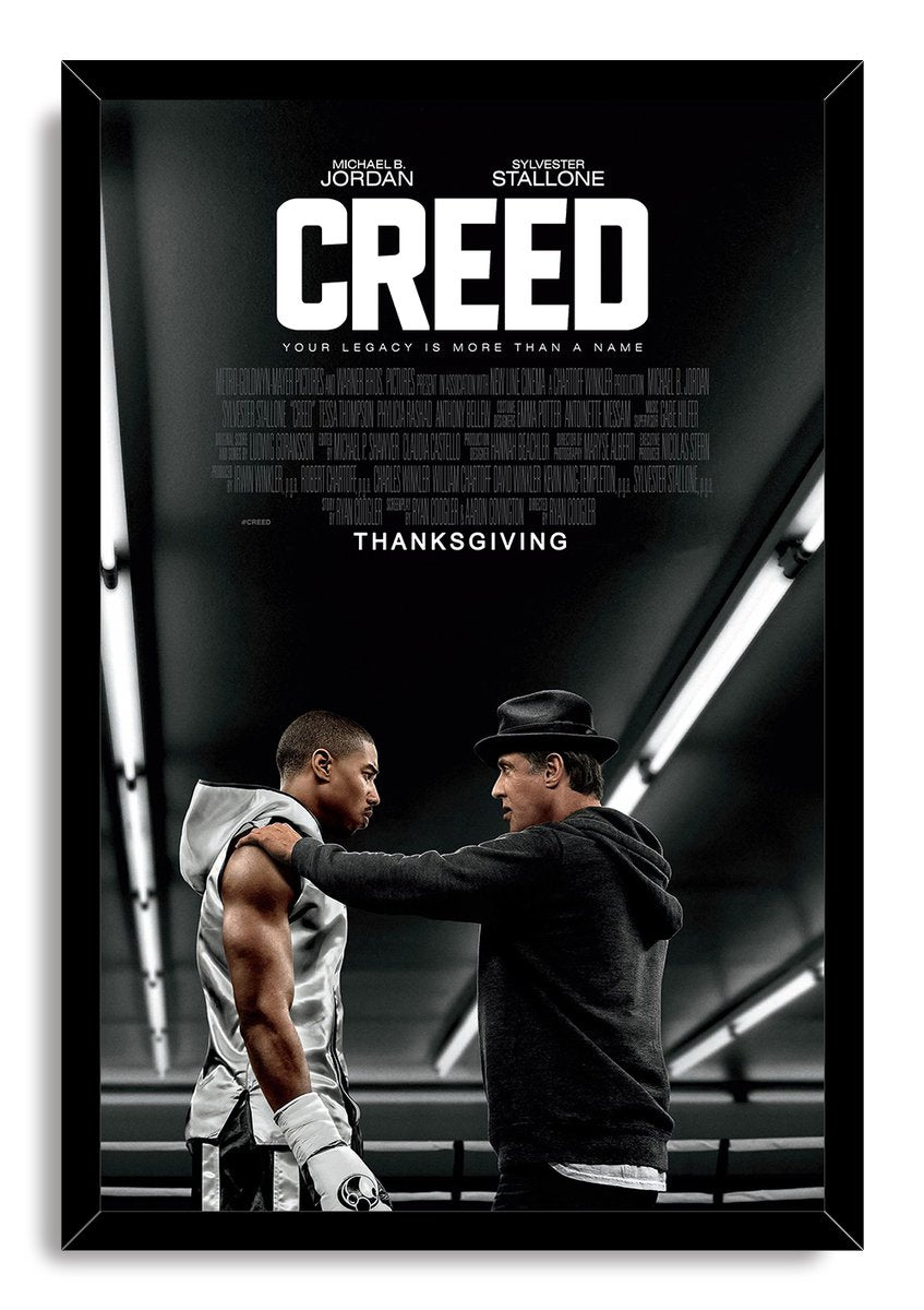 Framed Creed poster wall art print of Adonis Creed and Rocky Balboa facing one another under fluorescent gym lighting.