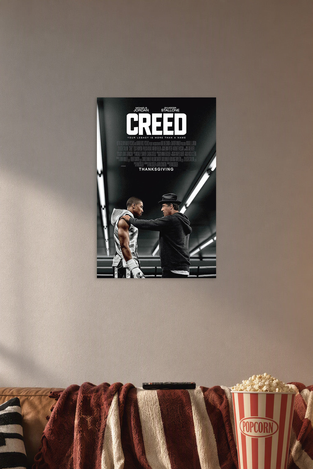Creed Movie Michael B. Jordan Sylvester Stallone in a cozy movie room above a brown sofa with popcorn.
