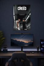 Creed Movie Michael B. Jordan Sylvester Stallone in a gaming desk setup above a monitor.