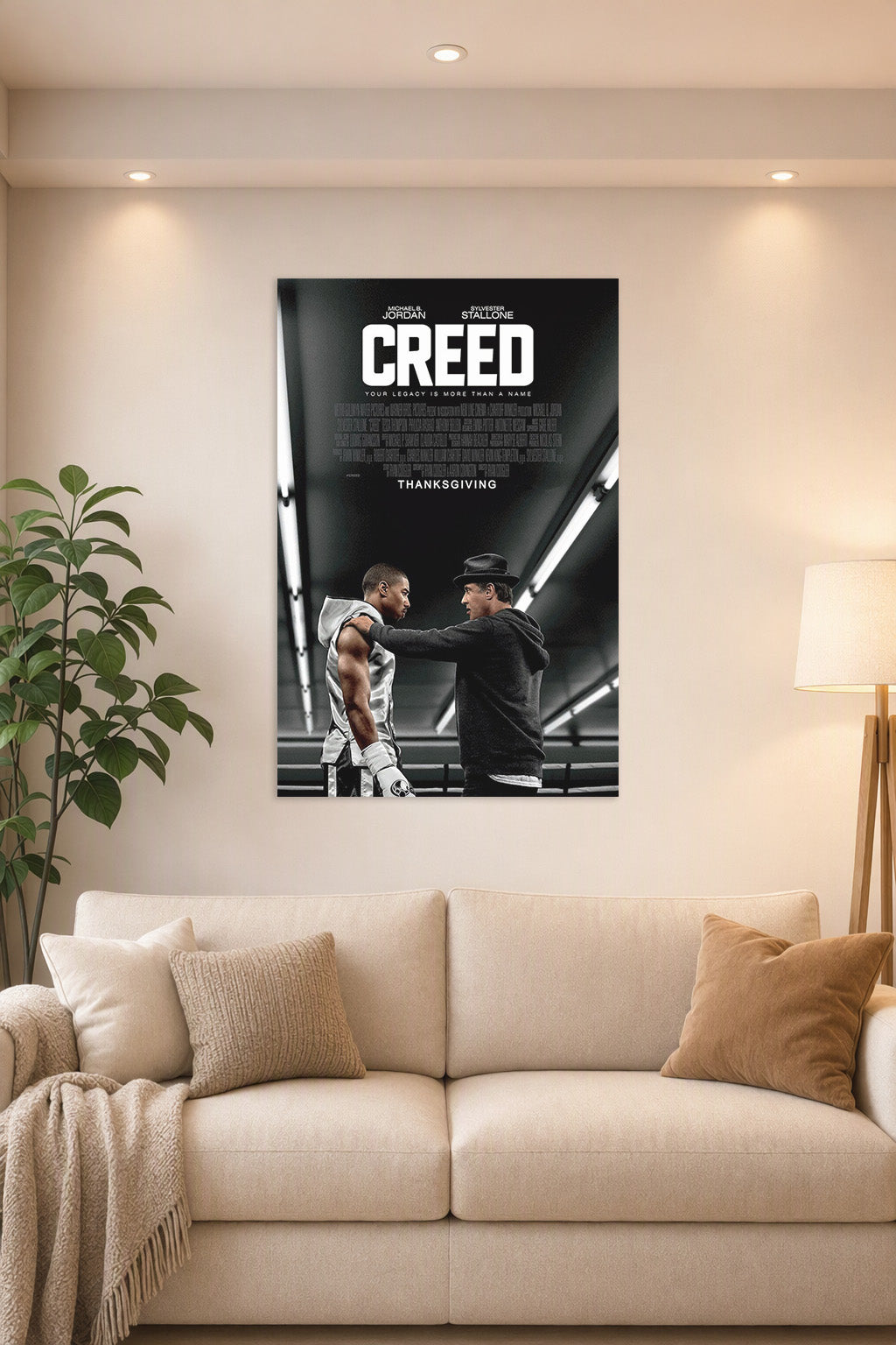 Creed Movie Michael B. Jordan Sylvester Stallone in a bright living room above a beige sofa.