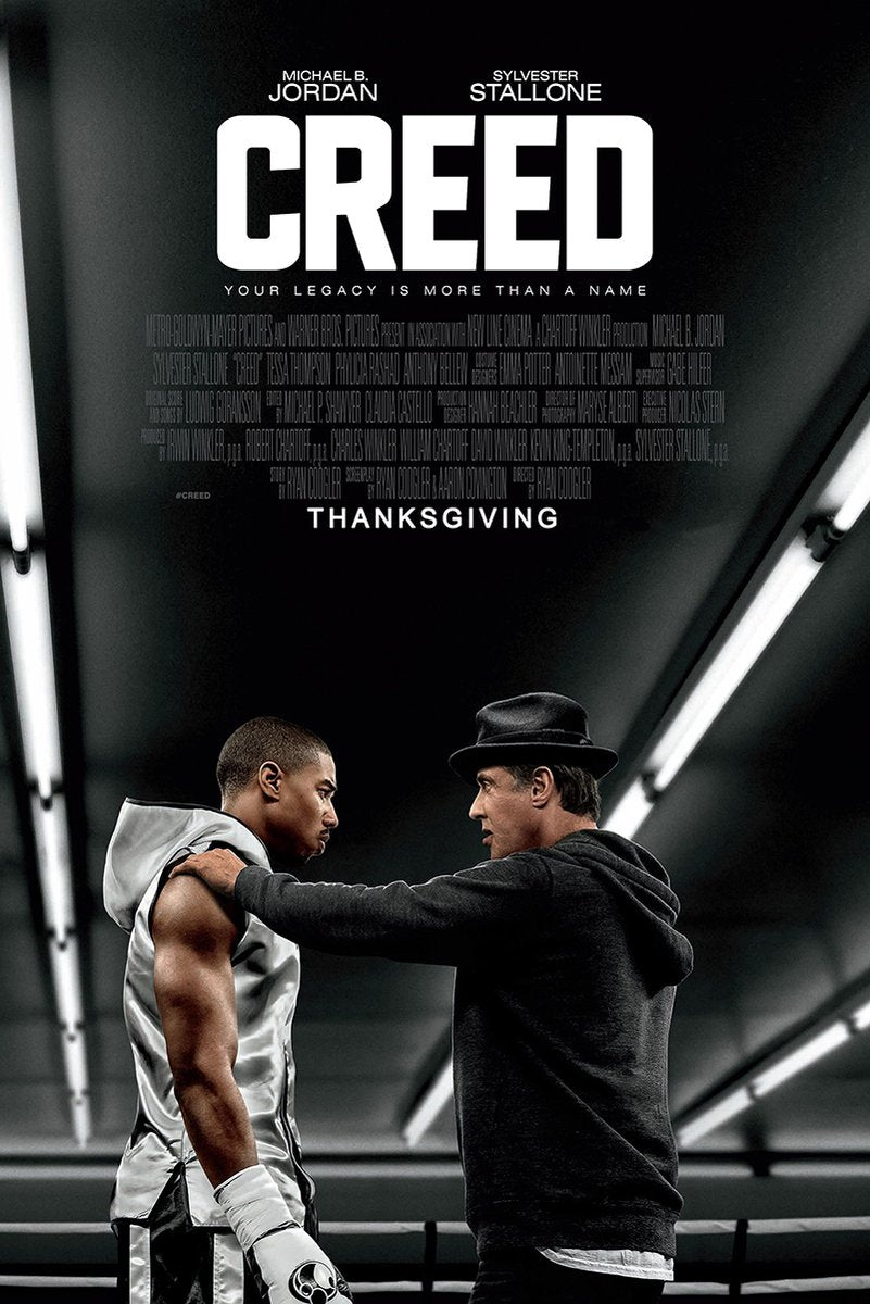 Creed movie poster wall art print with Adonis Creed in boxing gear facing Rocky Balboa beneath stark gym lights.