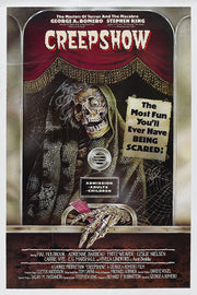 Creepshow movie poster wall art print features a hooded skeleton at a theater booth beneath red curtains and jagged white title text.