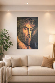Crucifixion of Jesus in a bright living room above a beige sofa.