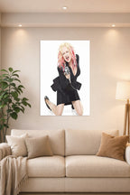 Cyndi Lauper in a bright living room above a beige sofa.