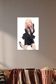 Cyndi Lauper in a cozy movie room above a brown sofa with popcorn.