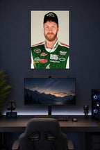 Dale Earnhardt Jr in a gaming desk setup above a monitor.
