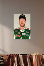 Dale Earnhardt Jr in a cozy movie room above a brown sofa with popcorn.
