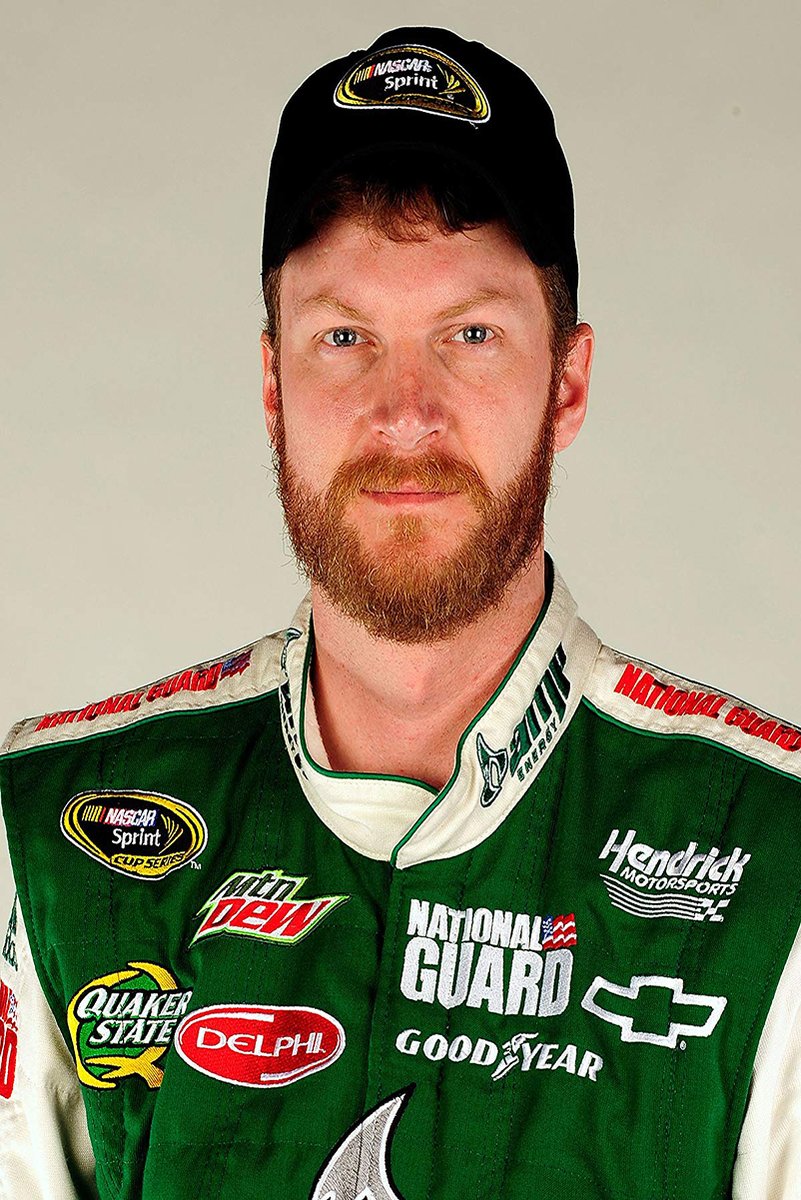 Dale Earnhardt Jr. poster portrait in a black NASCAR Sprint cap and green racing suit with sponsor patches.
