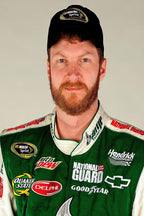 Dale Earnhardt Jr. poster portrait in a black NASCAR Sprint cap and green racing suit with sponsor patches.