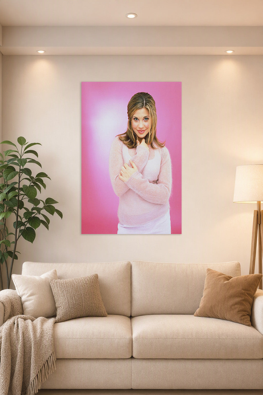 Danielle Fishel in a bright living room above a beige sofa.