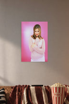Danielle Fishel in a cozy movie room above a brown sofa with popcorn.