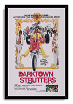 Darktown Strutters movie poster wall art print in a black frame, with women in white outfits, motorcycles, and a red trike.