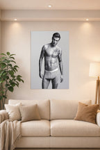 David Beckham in a bright living room above a beige sofa.
