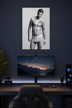 David Beckham in a gaming desk setup above a monitor.