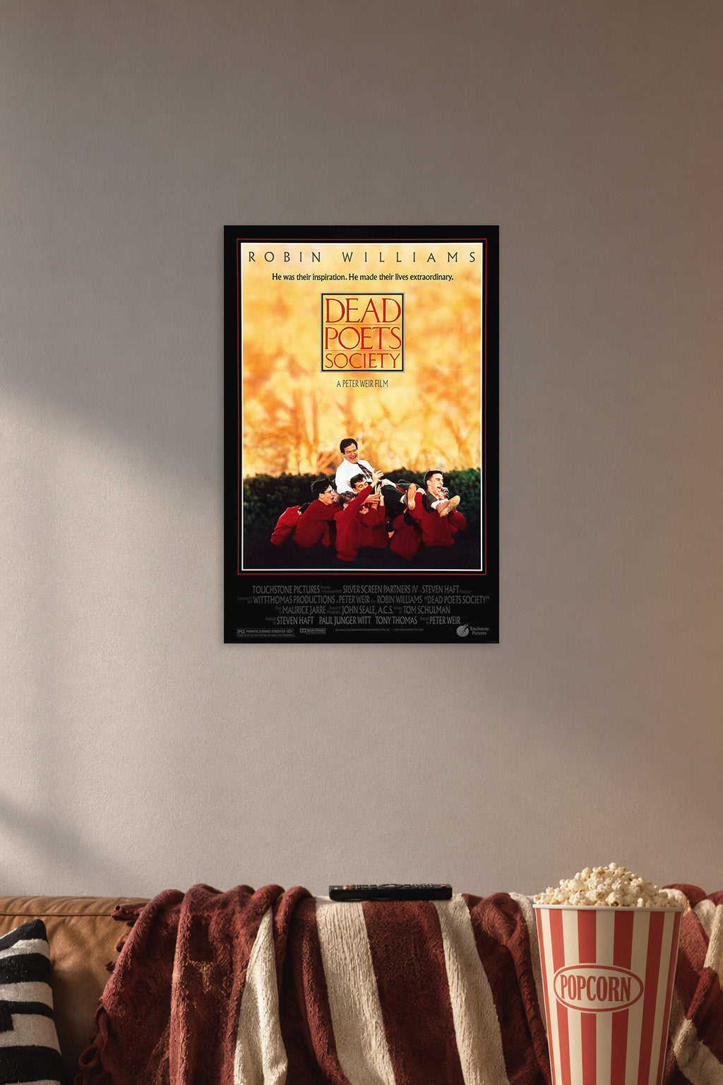 Dead Poets Society Movie in a cozy movie room above a brown sofa with popcorn.