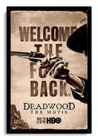Deadwood The Movie framed wall art print features a sepia gunman’s hand, distressed welcome lettering, and a black border frame.