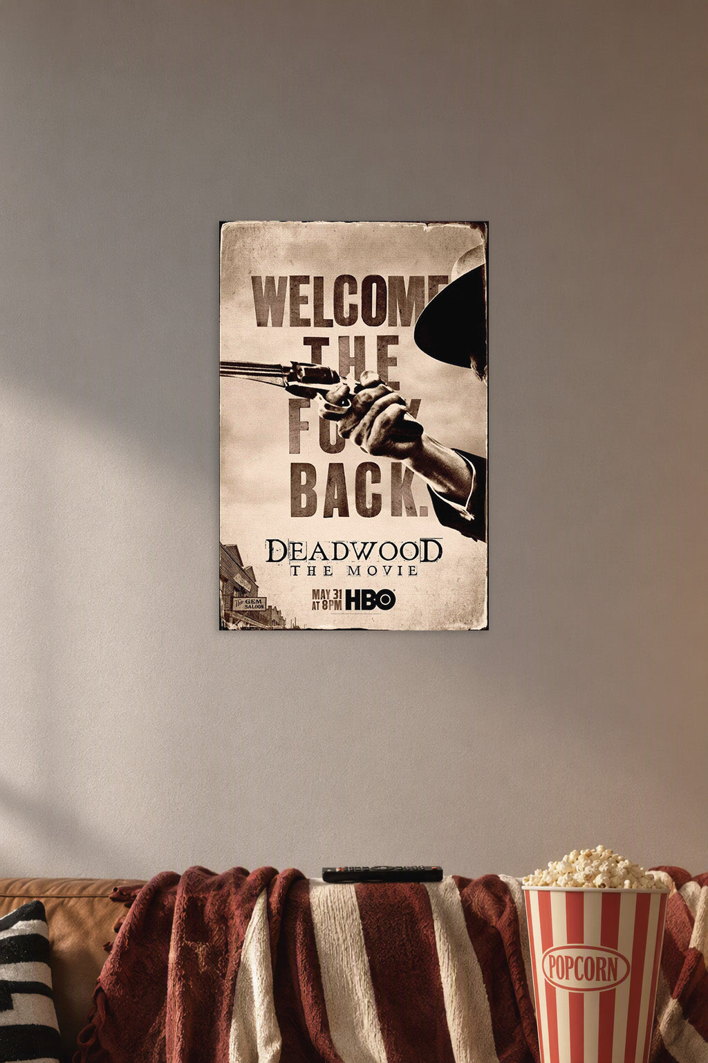 Deadwood The Movie Welcome Back in a cozy movie room above a brown sofa with popcorn.