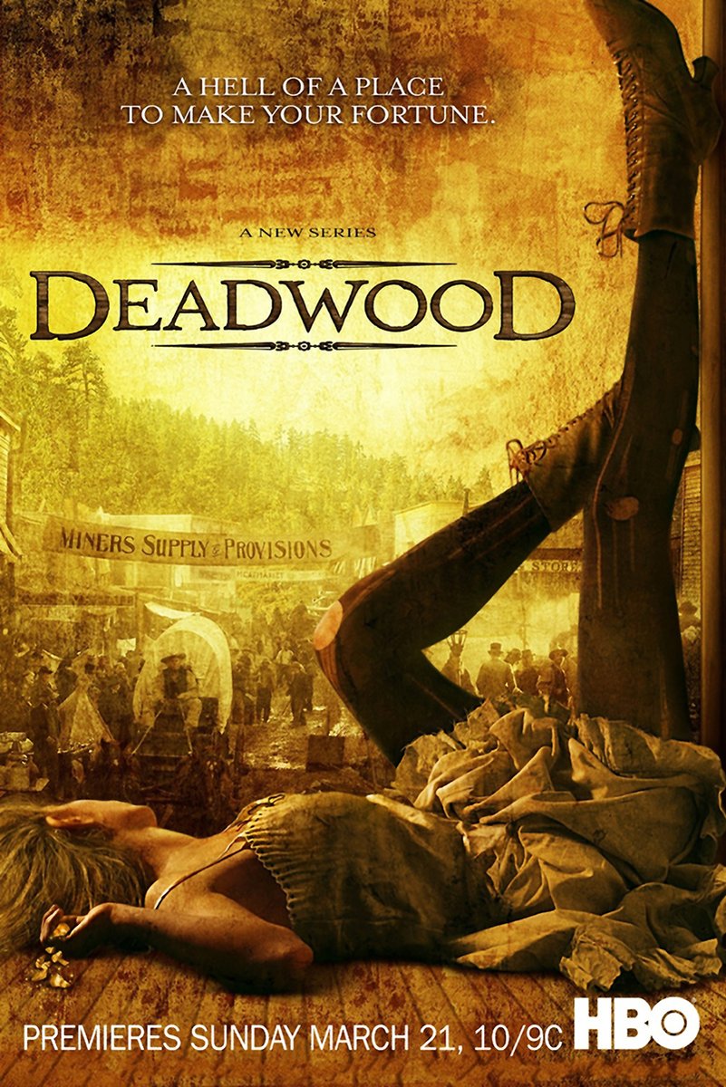 Deadwood wall art print in sepia tones, with a fallen woman, raised black boots, and a crowded frontier street behind the title.
