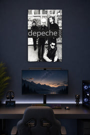 Depeche Mode in a gaming desk setup above a monitor.