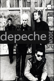 Depeche Mode poster features a black-and-white street photograph of four band members, with a bold black logo band across the center.
