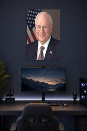 Dick Cheney in a gaming desk setup above a monitor.