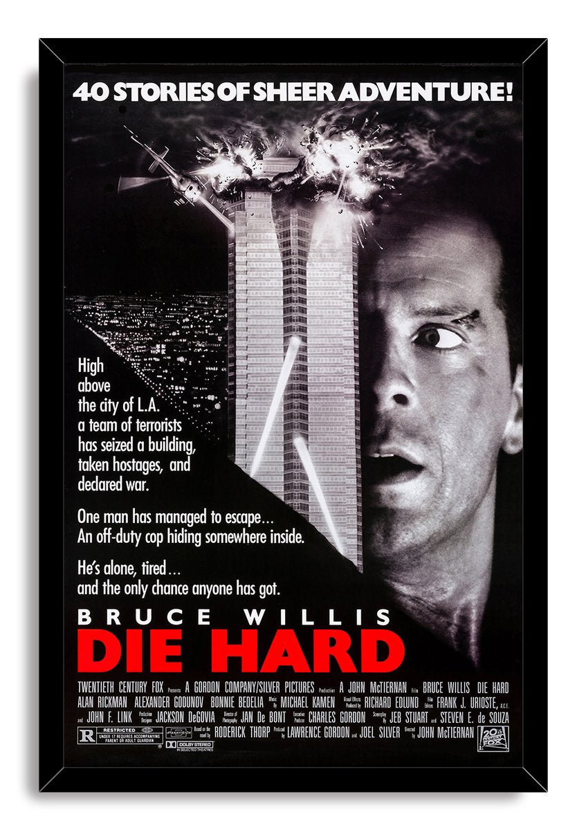 Die Hard framed wall art print with Bruce Willis's close-up, an exploding tower, city skyline, helicopter, and red title.