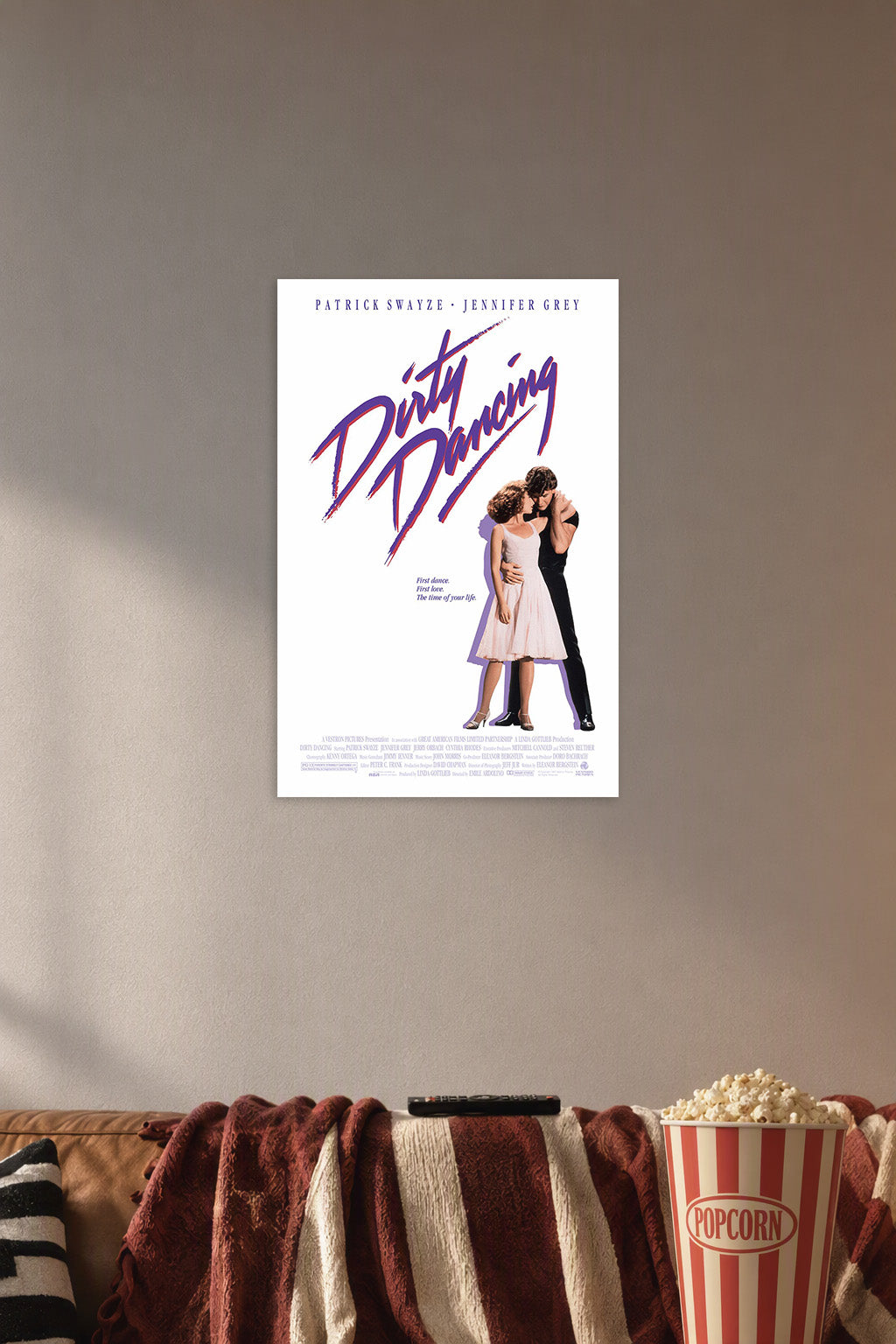 Dirty Dancing Movie in a cozy movie room above a brown sofa with popcorn.