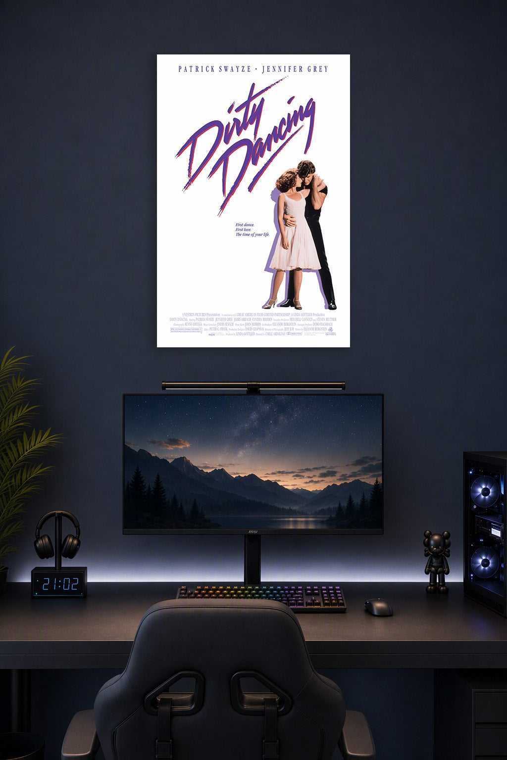 Dirty Dancing Movie in a gaming desk setup above a monitor.