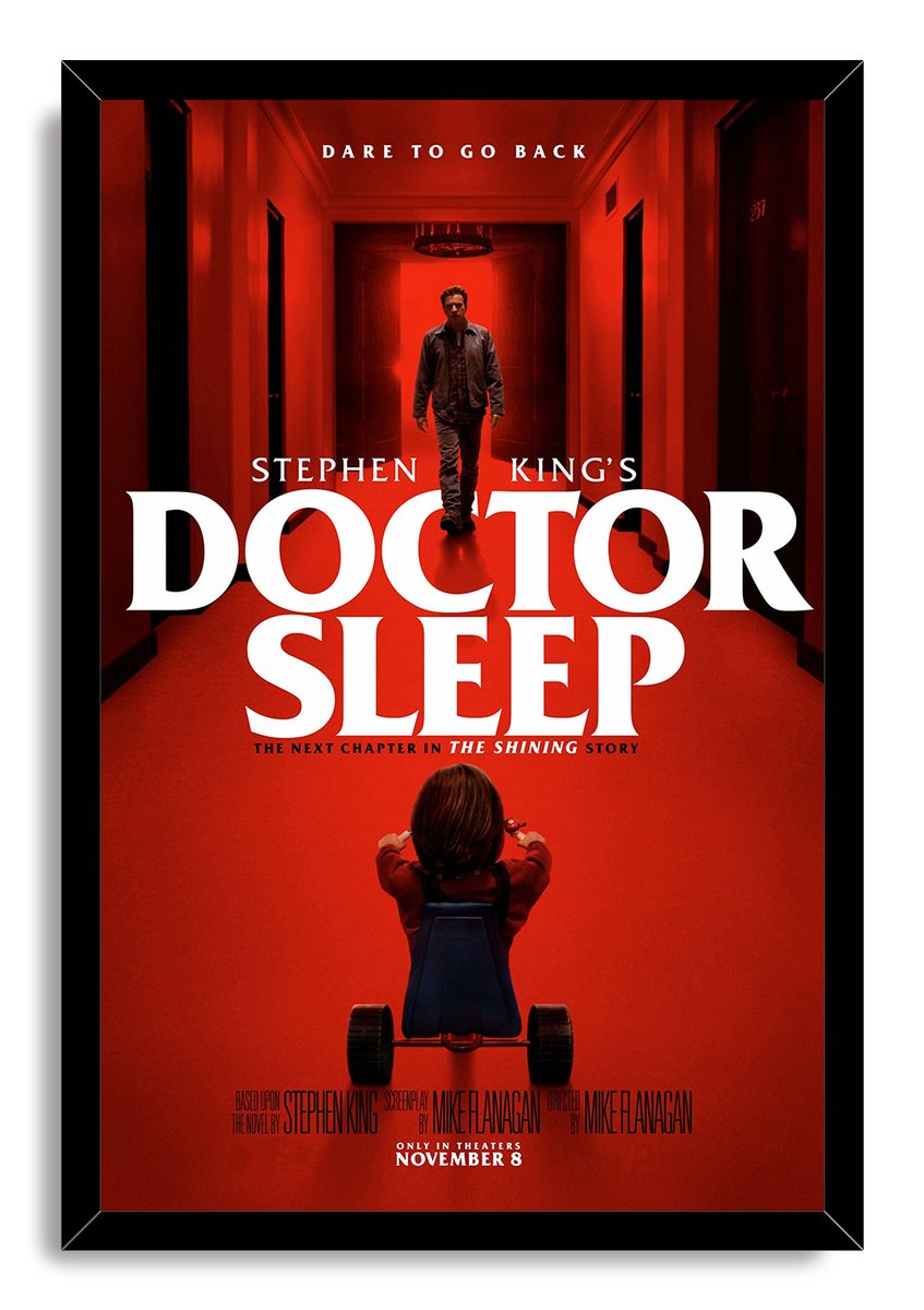 Doctor Sleep framed wall art print depicting a man in a crimson hallway facing a child on a tricycle.