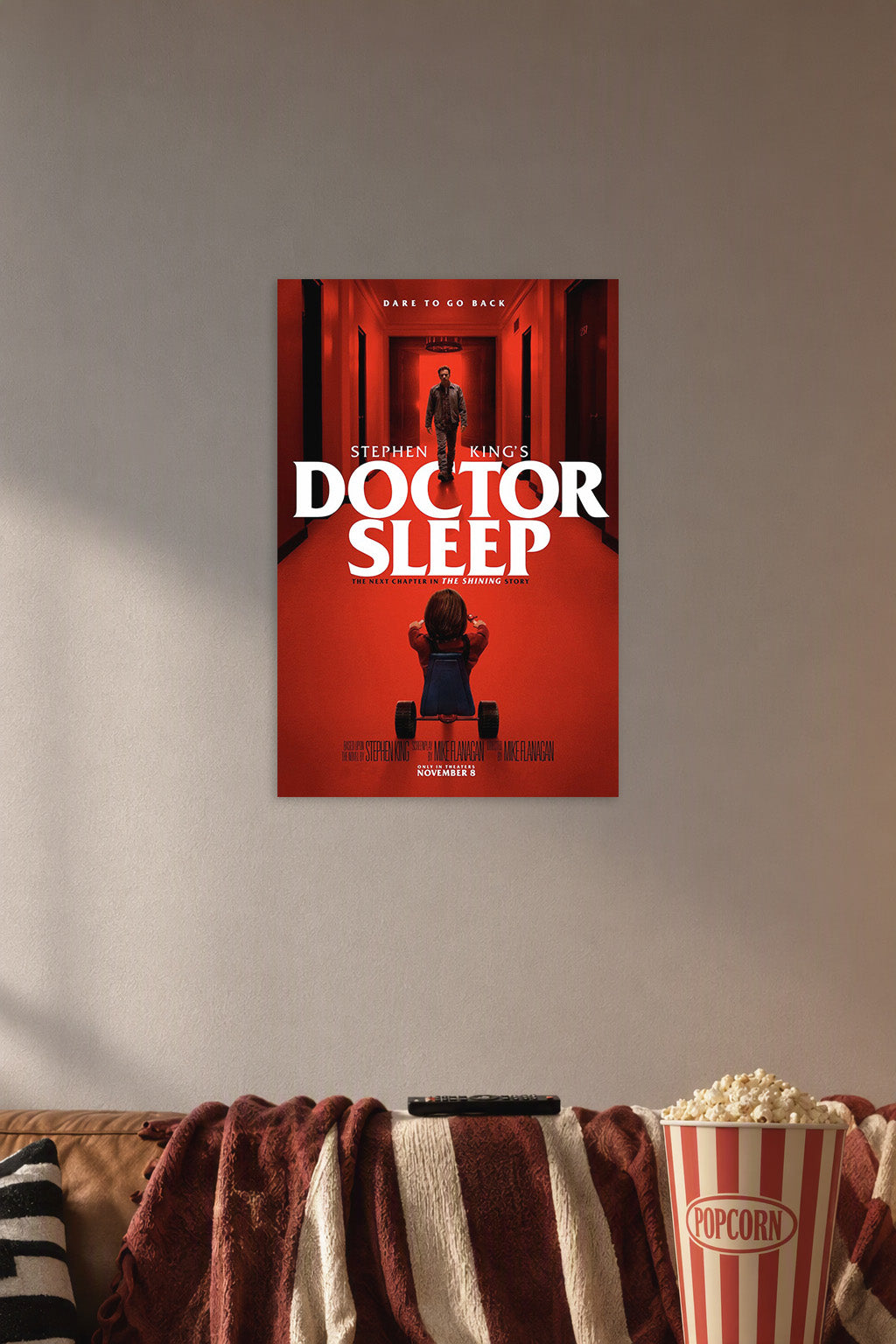 Doctor Sleep Movie in a cozy movie room above a brown sofa with popcorn.