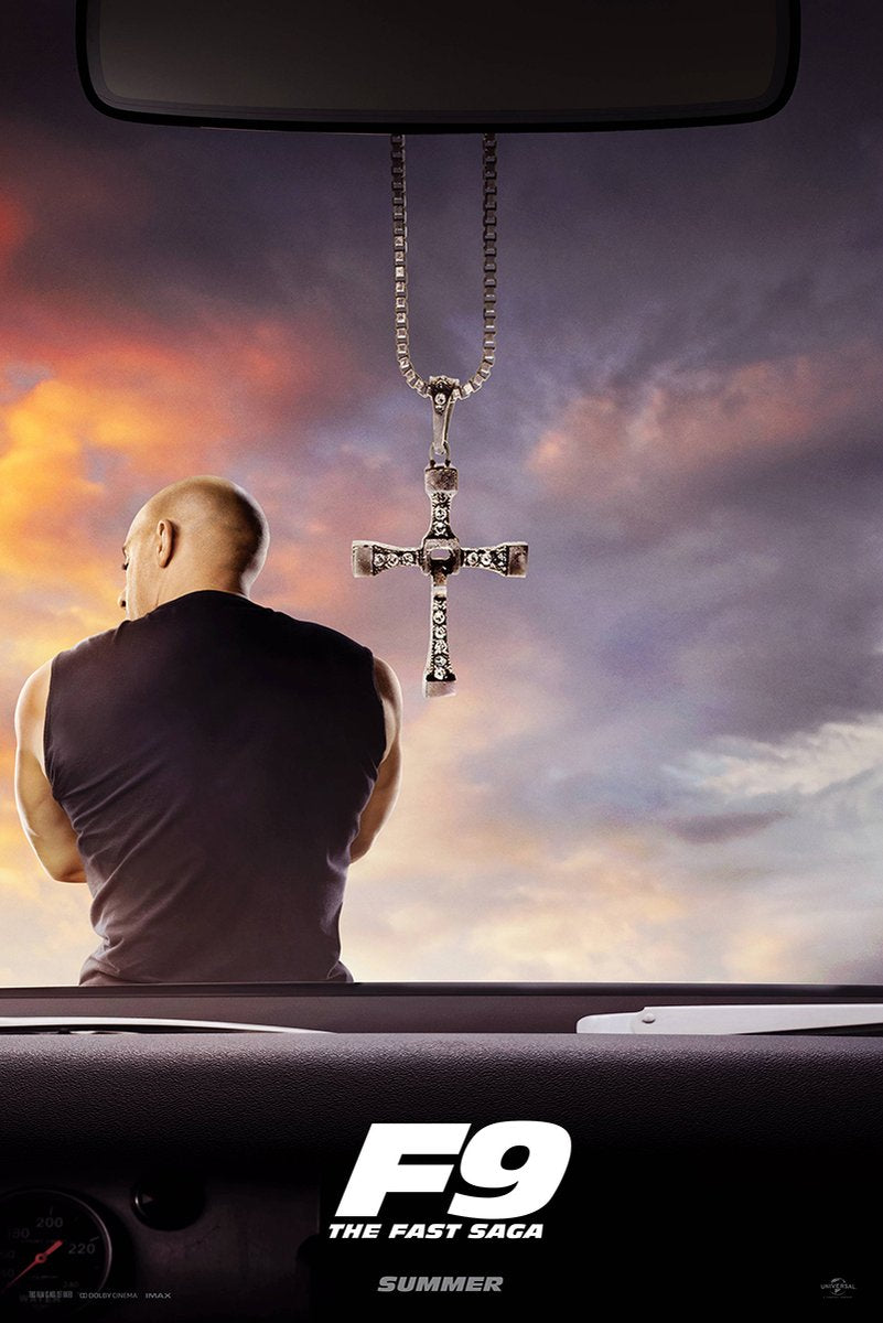 Dominick Toretto F9 wall art print viewed through a car windshield, with a hanging cross against an orange and purple sunset.