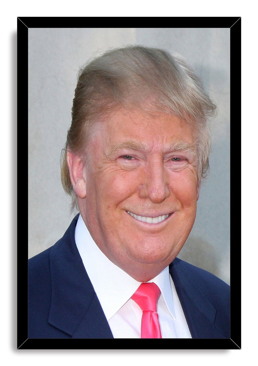 Donald Trump framed wall art print with a black border, featuring a smiling portrait in a navy suit and vivid pink tie.