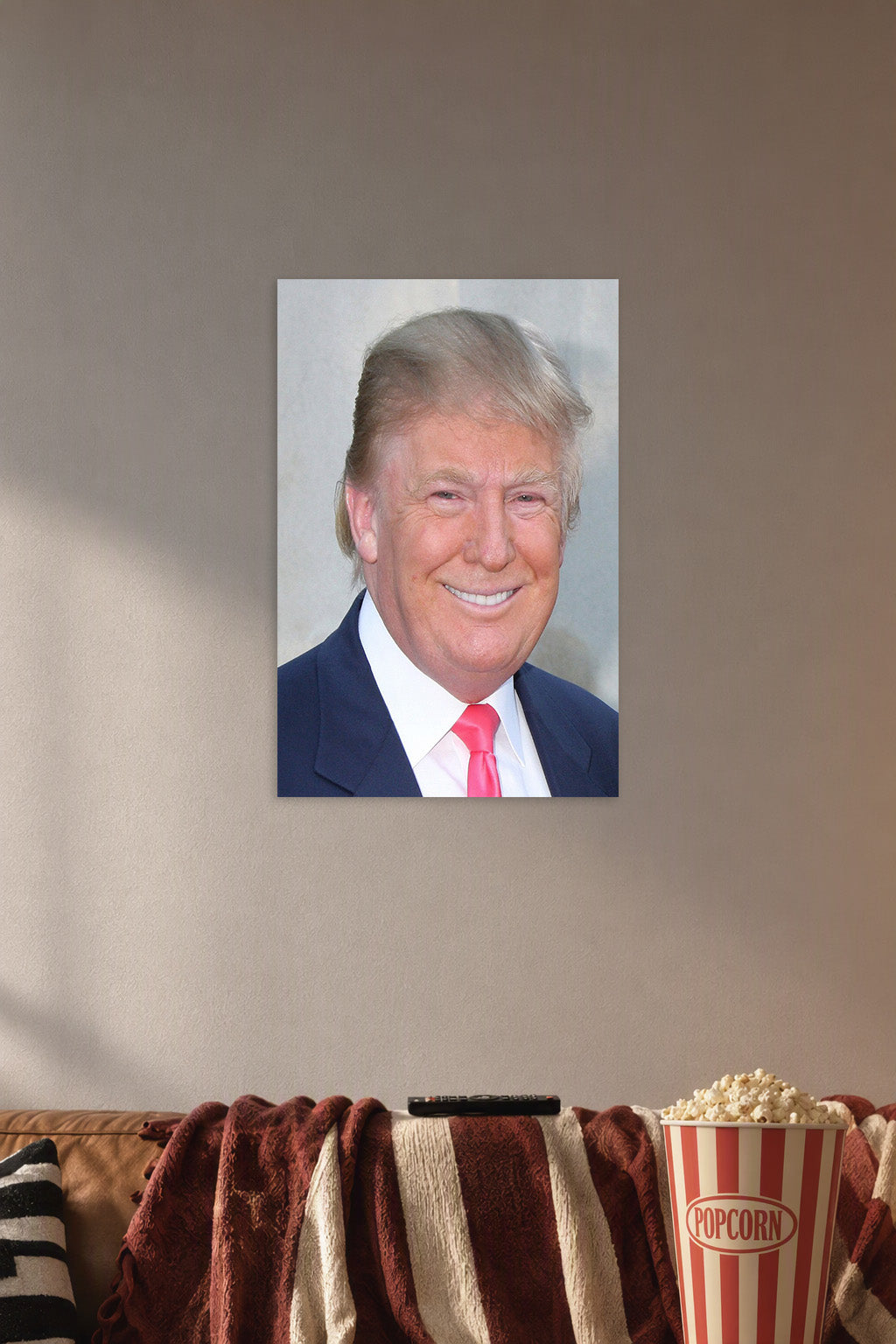 Donald Trump in a cozy movie room above a brown sofa with popcorn.