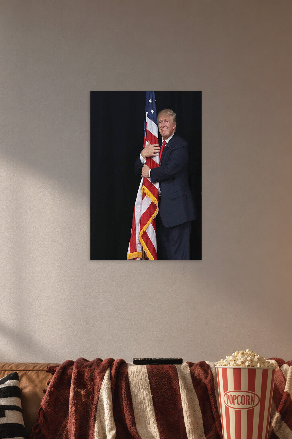 Donald Trump and American Flag in a cozy movie room above a brown sofa with popcorn.
