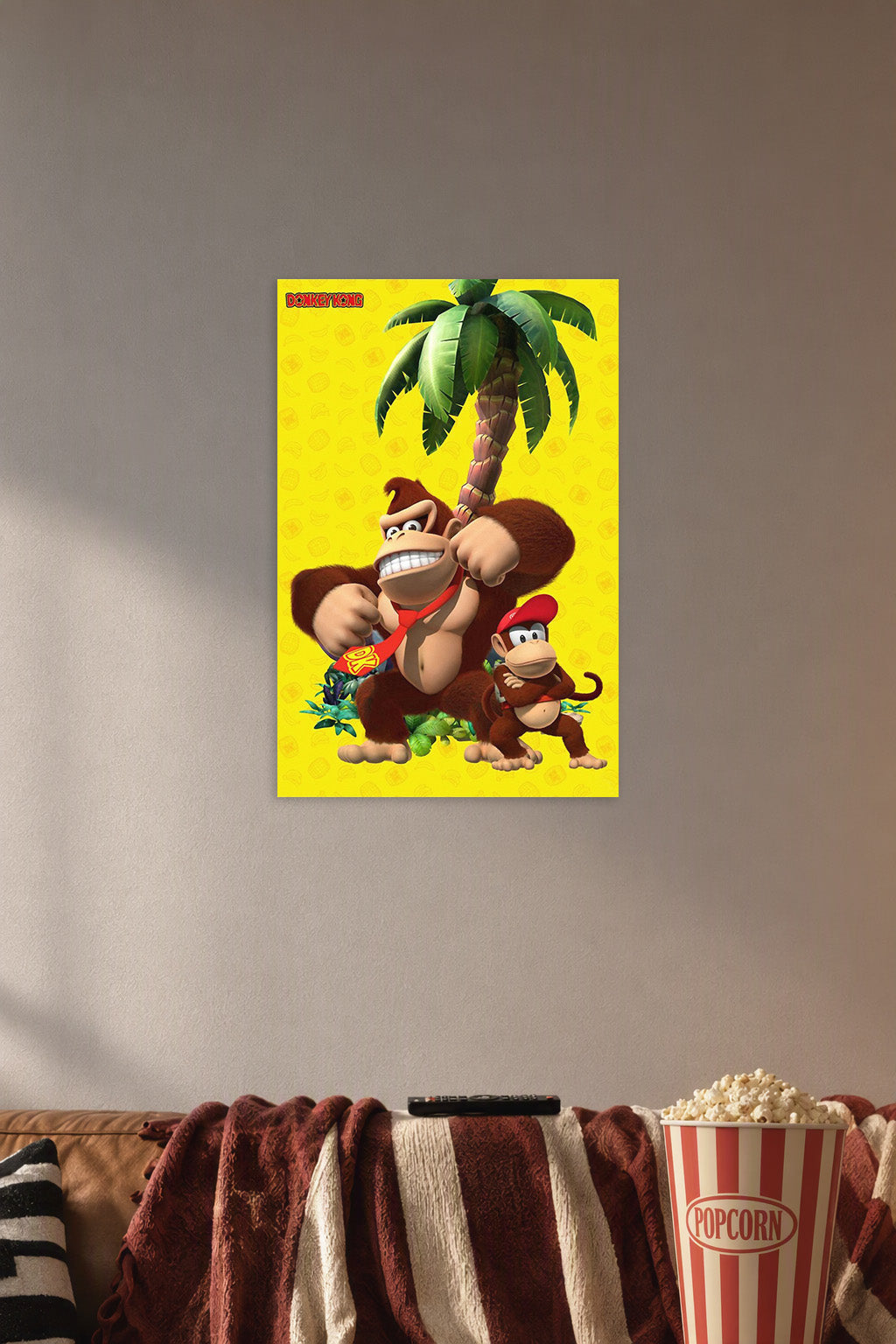 Donkey Kong and Diddy Kong in a cozy movie room above a brown sofa with popcorn.