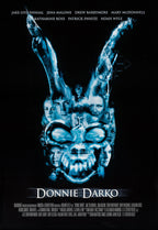 Donnie Darko poster features a blue skull-shaped collage of faces and raised arms against a black background.