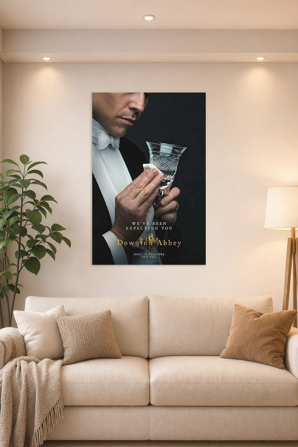Downton Abbey Butler in a bright living room above a beige sofa.