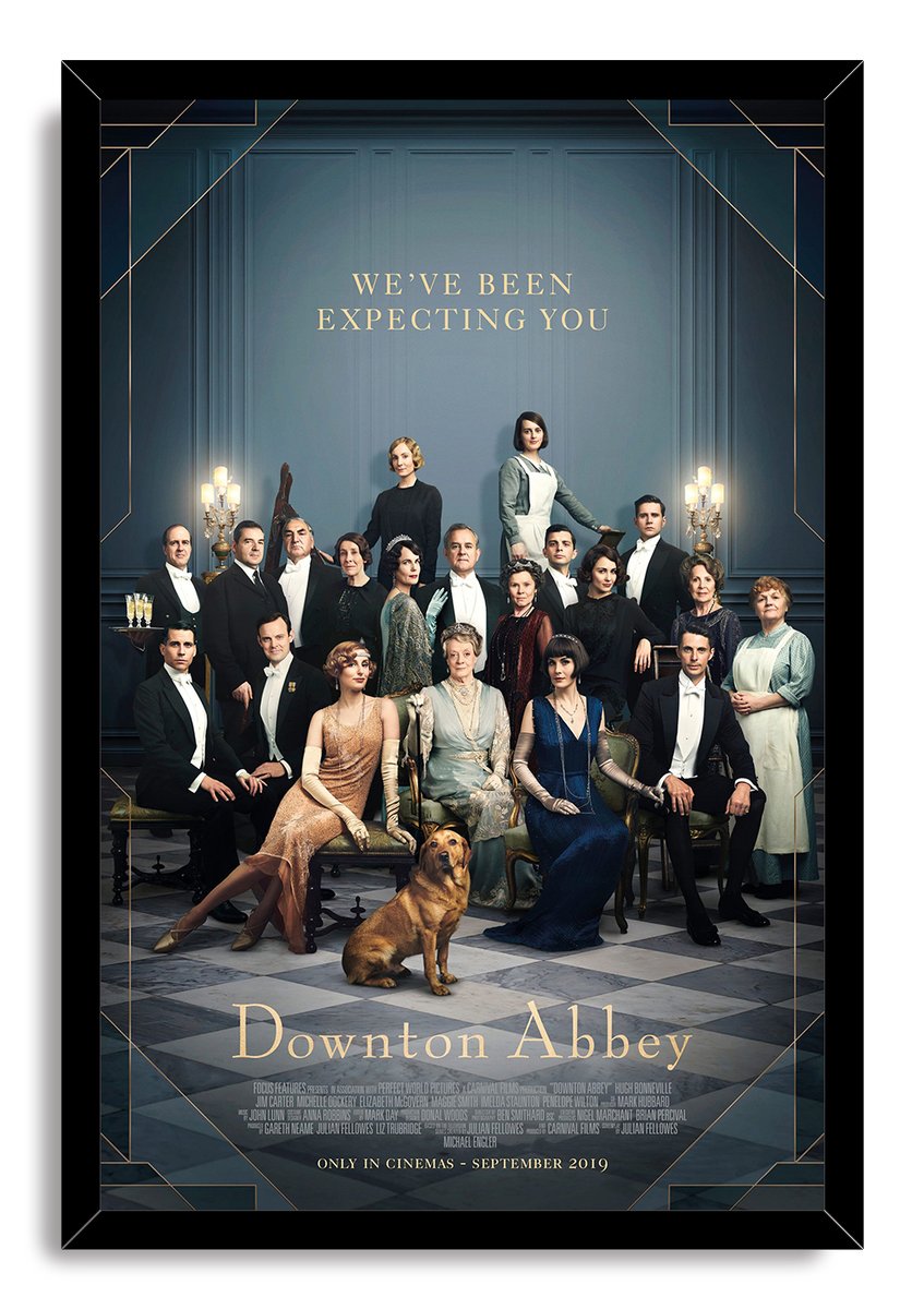 Downton Abbey framed wall art print presents the period-costumed cast and golden dog beneath the words “We’ve Been Expecting You.